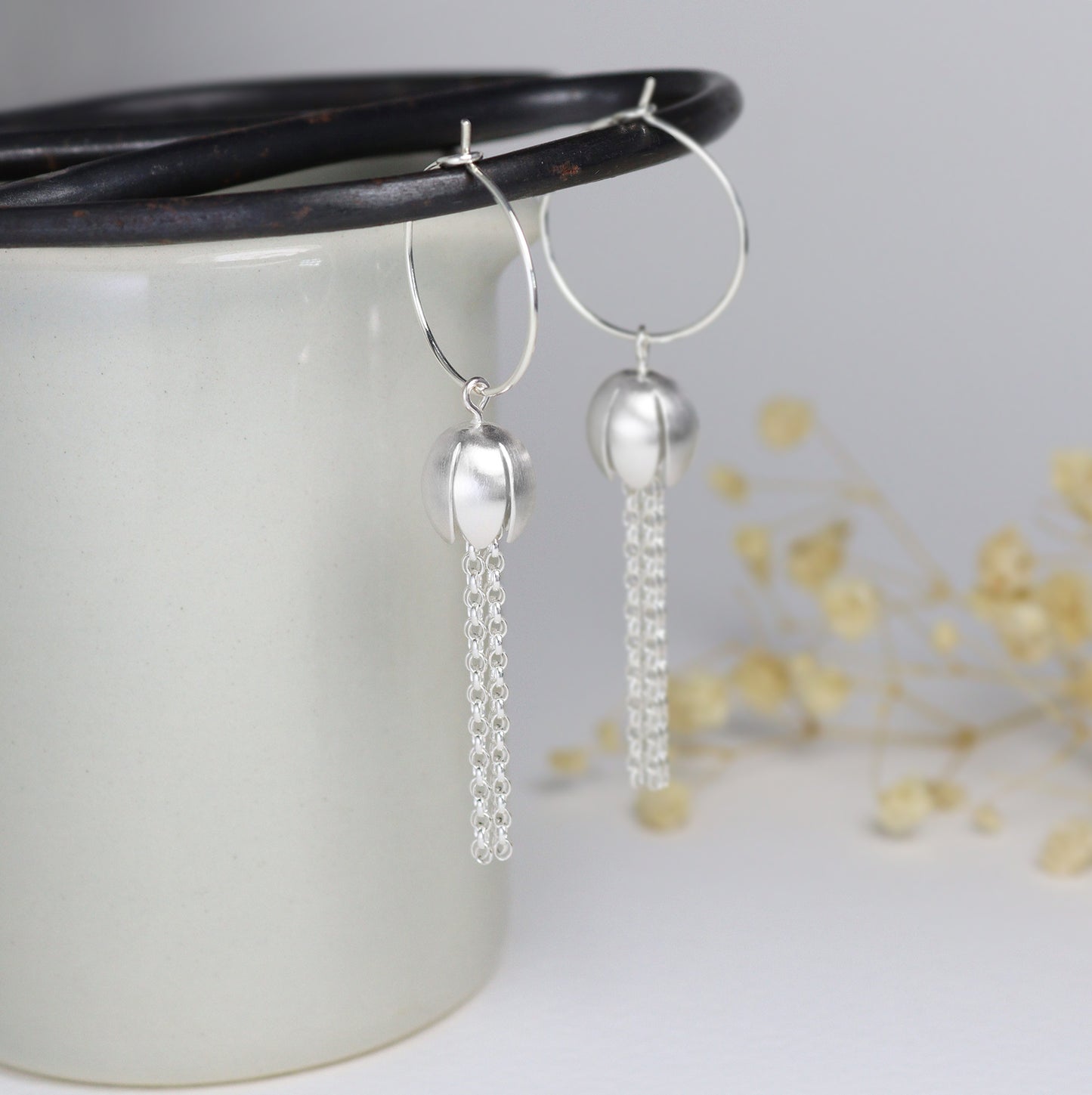 Silver crocus with tassels hoop earrings